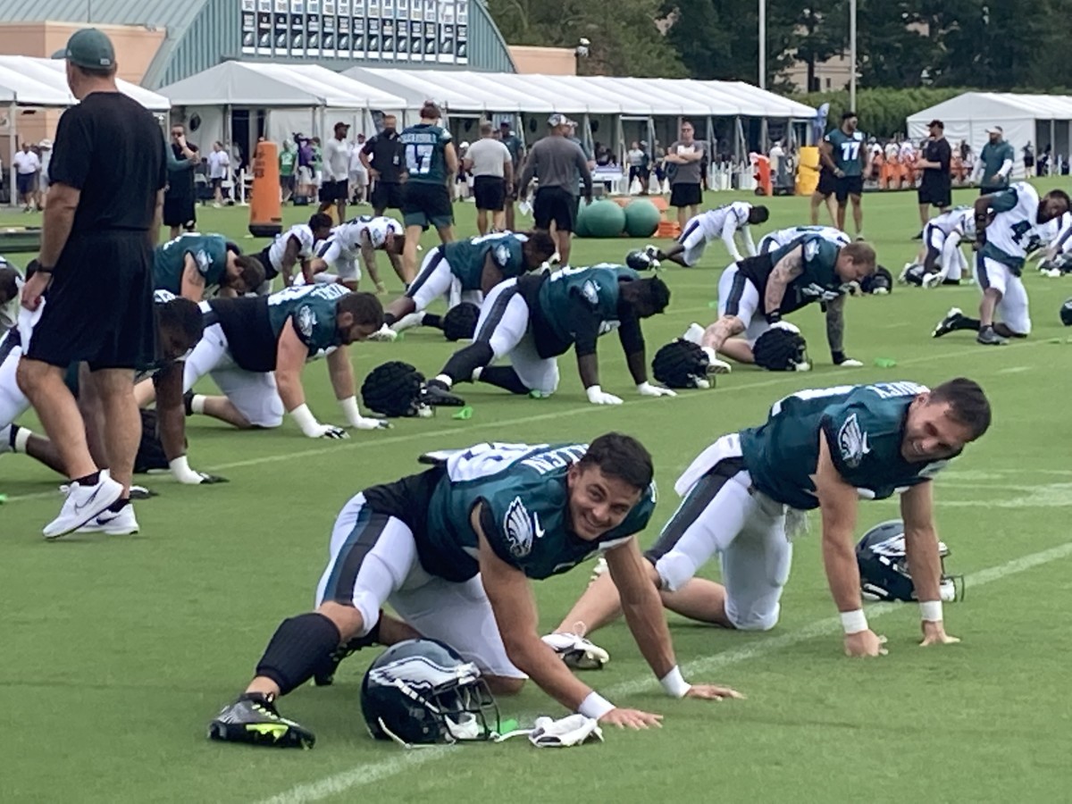 Devon Allen (left) and Britain Covey go through pre-practice stretches
